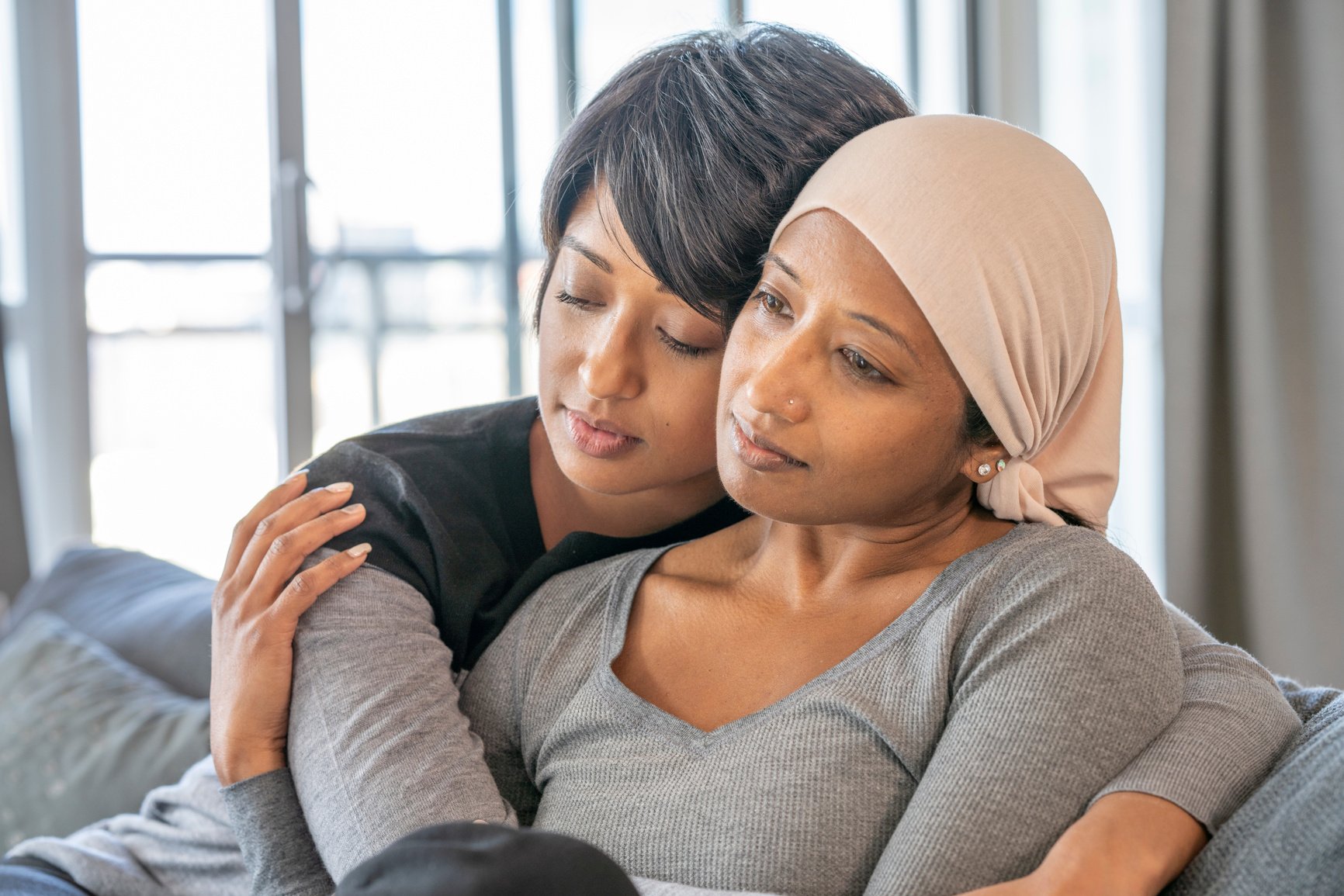 Cancer Patient Embracing her Daughter stock photo