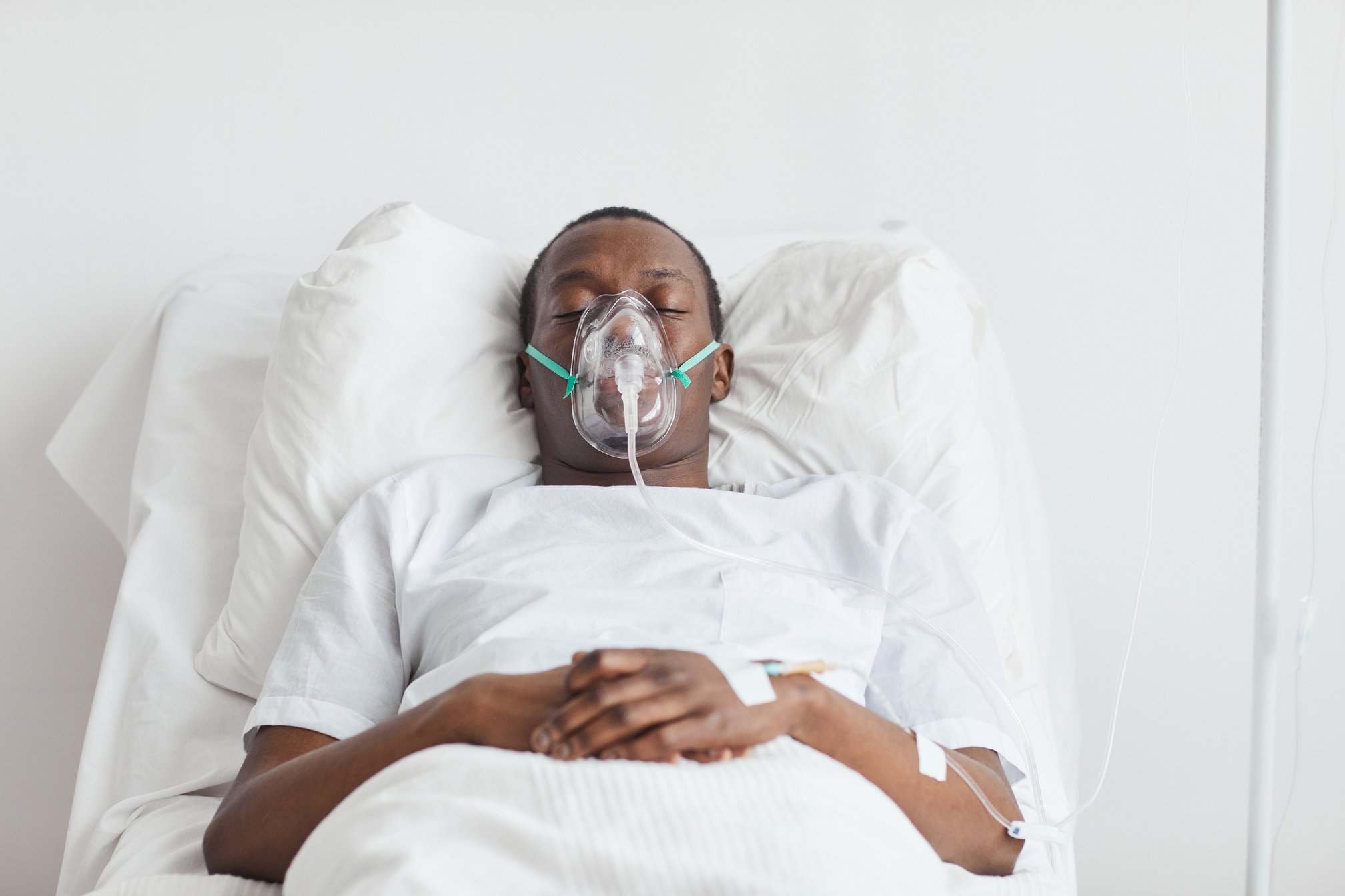 Sick African American Man on Hospital Bed